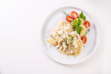 White fish on a plate. Beautifully served fish on a plate with vegetables and spices. High quality photo