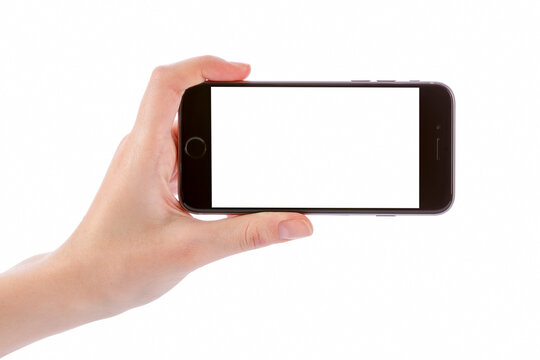 Hand holding black smart phone isolated on white clipping path inside