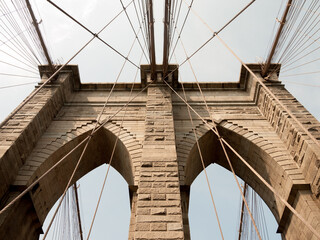 Worms eye view of the two arches on the Brooklyn Bridge. Manhattan, NYC