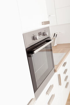 Modern stainless oven in modern white new kitchen. Interior kitchen design.