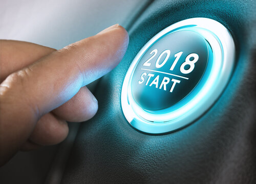 Hand pressing a 2018 start button. Concept of new year, two thousand eighteen. Composite between a photography and a 3D background. Horizontal image