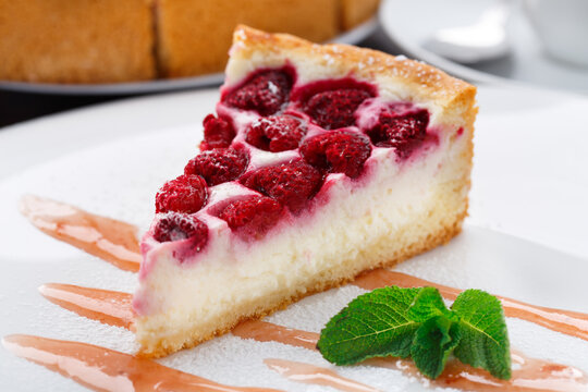 Delicious cheesecake with raspberries on a plate