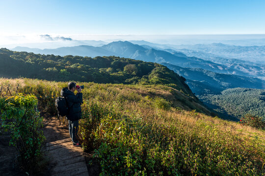 Man with camera shoot viwe at  kew mae parn viewpoint.Doi Inthanon Chiang Mai in Thailand