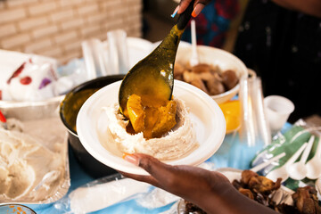 service of taro with yellow sauce, traditional African dish from West Cameroon.