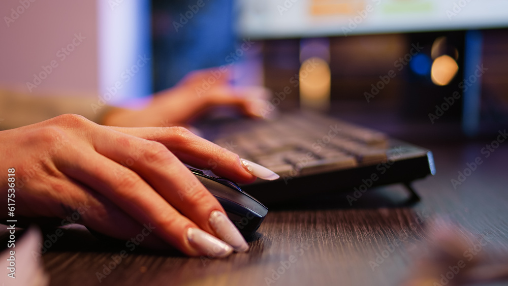 Poster company employee working on computer at night and typing data to create financial graphs report. man