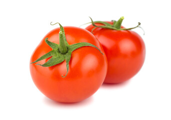 Two ripe red tomatoes isolated on white background