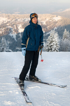 Woman-skier in snowy mountains. Photo about winter vacations.