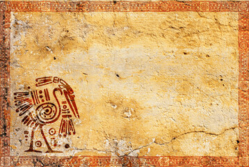 Background with grunge stucco wall texture of yellow color and American Indian traditional patterns with heron