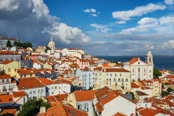 Fototapeta premium View of Lisbon famous postcard iconic view from Miradouro de Santa Luzia tourist viewpoint over Alfama old city district. Lisbon, Portugal.