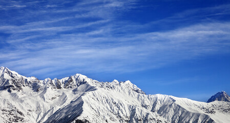 Fototapeta na wymiar Panoramic view on winter mountains at sun winter day. View from ski lift on Hatsvali, Svaneti region of Georgia. Caucasus Mountains.