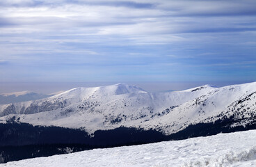 Fototapeta na wymiar Winter mountains and cloudy sky. Carpathian Mountains, Ukraine.