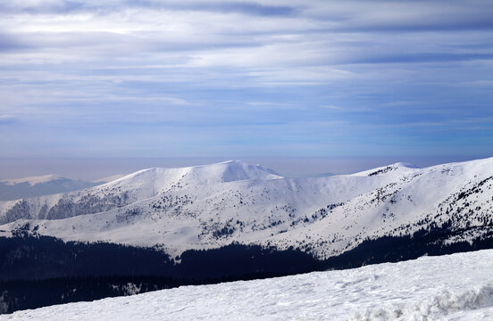 Winter mountains and cloudy sky. Carpathian Mountains, Ukraine.