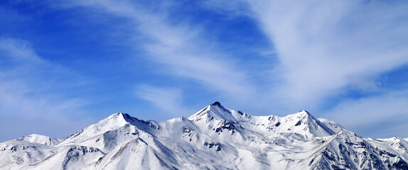 Panoramic view on winter snow mountains. Caucasus Mountains, Georgia, region Gudauri. View from ski resort.
