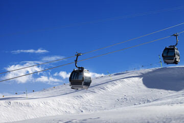 Gondola lifts on ski resort at sun wind day. Greater Caucasus, Mount Shahdagh, Azerbaijan.