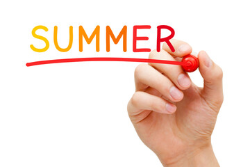 Hand writing Summer concept with different warm colored markers on transparent glass board.