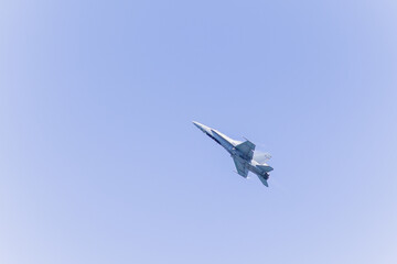 Fototapeta na wymiar Jet fighter military airplane war force during aviation airshow. Aircraft plane technology