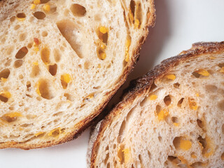 Sliced homemade sourdough bread with cheese.