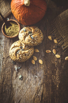 Healthy eating. Pumpkins with pumpkin flour and bread. Pumpkin oil on wood