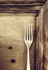 Food background. wood with fork