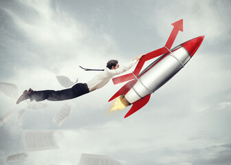 Businessman flying attached to a missile with an arrow. take-off business success concept  . 3D...