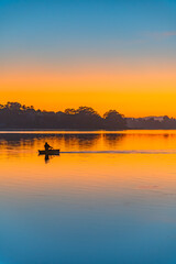 Sunrise at the waterfront in orange and blue