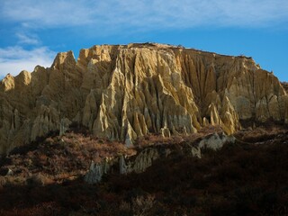 Panorama view of Omarama Clay Cliffs geological natural erosion silt and sand rock formation in...