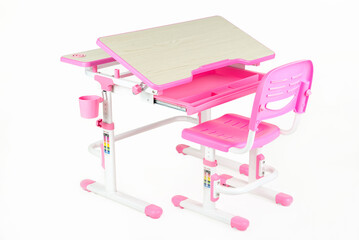 School desk and chair pink color on a white background isolated