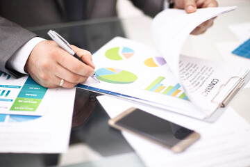 Businesssman recodnize business his business report in office
