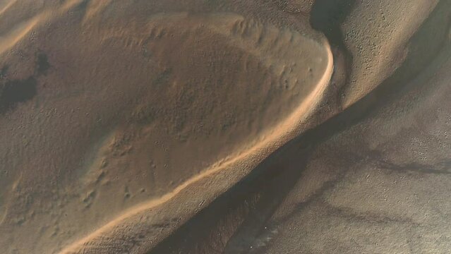Coastal Pilbara region of Australia tidal mud flats and ocean. Abstract aerial drone patterns and shapes Cossack 4K