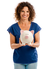 Fototapeta na wymiar Portrait of a happy middle aged woman holding a Piggybank