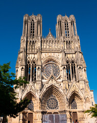 View of magnificent gothic building of Notre-Dame de Reims, Roman Catholic cathedral in Place du...