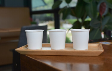 Drinks, milk and coffee, are on the table.