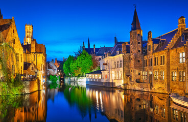 Obraz premium Bruges. Channel Rozenhoedkaai view to Perez de Malvenda house and Belfort tower. Belgium blue evening time.