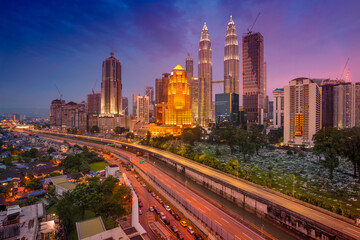 Cityscape image of Kuala Lumpur, Malaysia during twilight blue hour.
