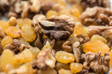 raisins and walnuts closeup background. macro photography