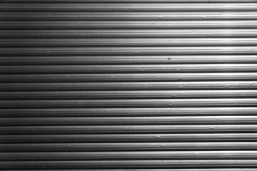 Fototapeta premium Roller shutters metal texture. Abstract black and white background.