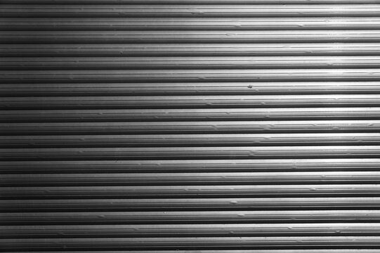 Roller shutters metal texture. Abstract black and white background.