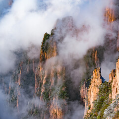 Clouds above the colorful peaks of Huangshan National park. China.