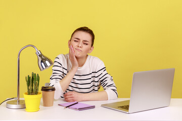 Unhealthy dissatisfied woman manager touching cheek feeling pain and discomfort in oral cavity,...