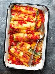 close up of rustic italian spinach ricotta cannelloni pasta