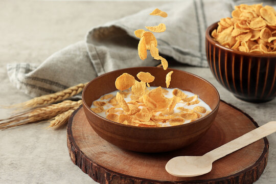 Cornflakes in Brown Bowl with Milk