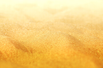 Beautiful texture of yellow sand photographed in close-up