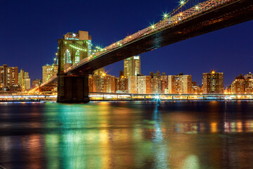 Fototapeta na wymiar New York City - beautiful sunset over manhattan with manhattan and brooklyn bridge