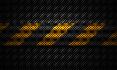 Abstract modern black perforated plate textured material design with warning tape of yellow carbon fiber in center for background, wallpaper, graphic design
