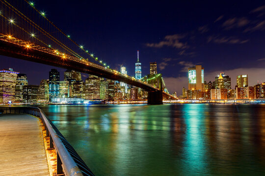Brooklyn Bridge over East River at night in New York City