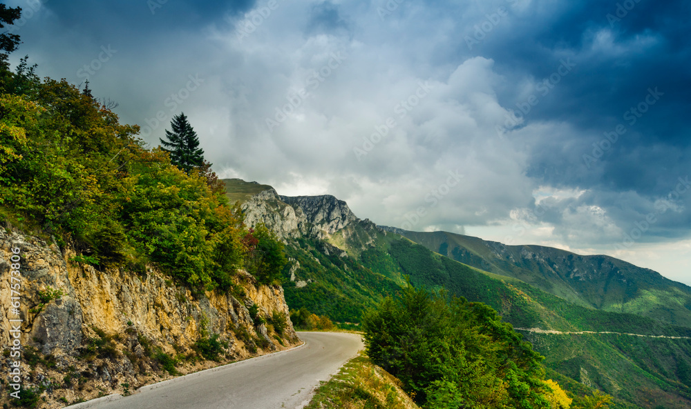 Wall mural Mauntain landscape with dramatic clouds