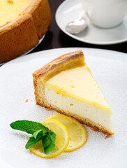 Delicious lemon cheesecake on a white plate