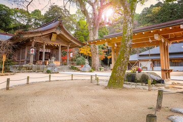 Fototapeta premium Fukuoka, Japan - Nov 30 2022: Homangu Kamado shrine located at Mt. Homan, venerated from ancient times as a sacred mountain, the shrine probably the inspiration for Kimetsu no Yaiba: Demon Slayer