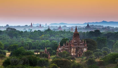 Fotobehang Scenic view of ancient Bagan temple during golden hour © Designpics