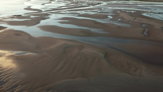 Coastal Pilbara region of Australia tidal mud flats and ocean. Abstract aerial drone patterns and shapes Cossack 4K